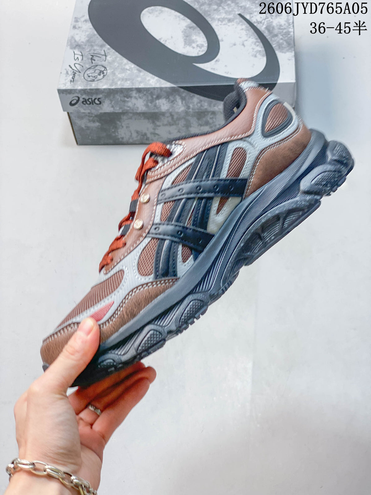 Side profile highlighting the mesh panels, layered overlays, and sole.
