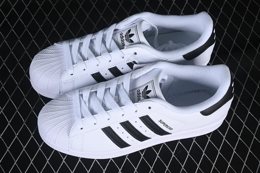 Pair of white and black Superstar II sneakers viewed from above