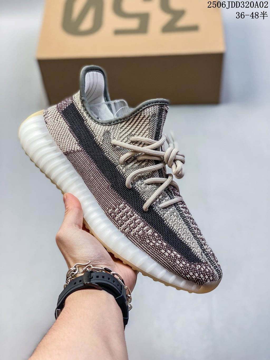 Multicolor neutral Adidas Yeezy-style sneaker with a dark side stripe and pale sole