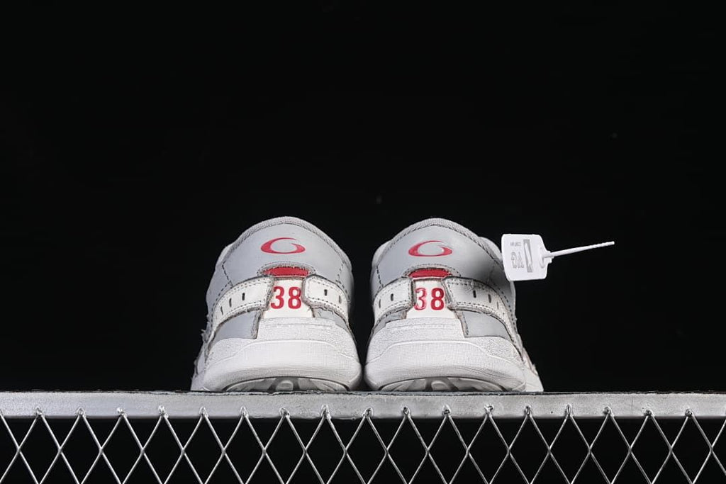Rear view of both sneakers, each showing size 38