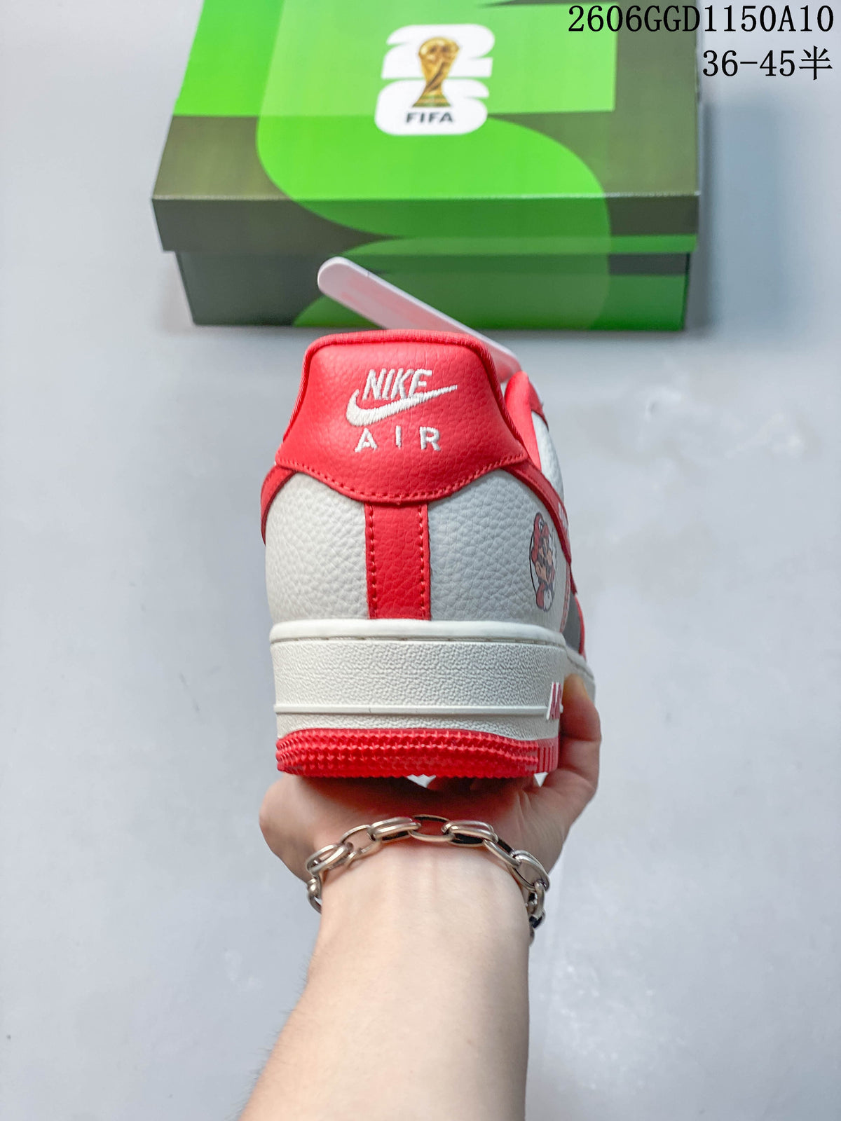 Rear view showing the red heel tab and off-white heel panels.