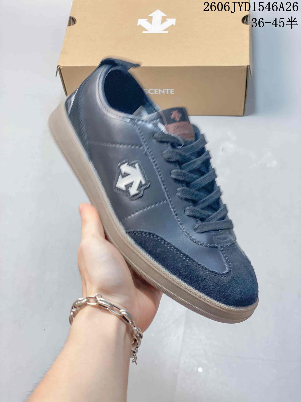 Close-up of a dark navy Descente low-top sneaker with a contrasting outsole.