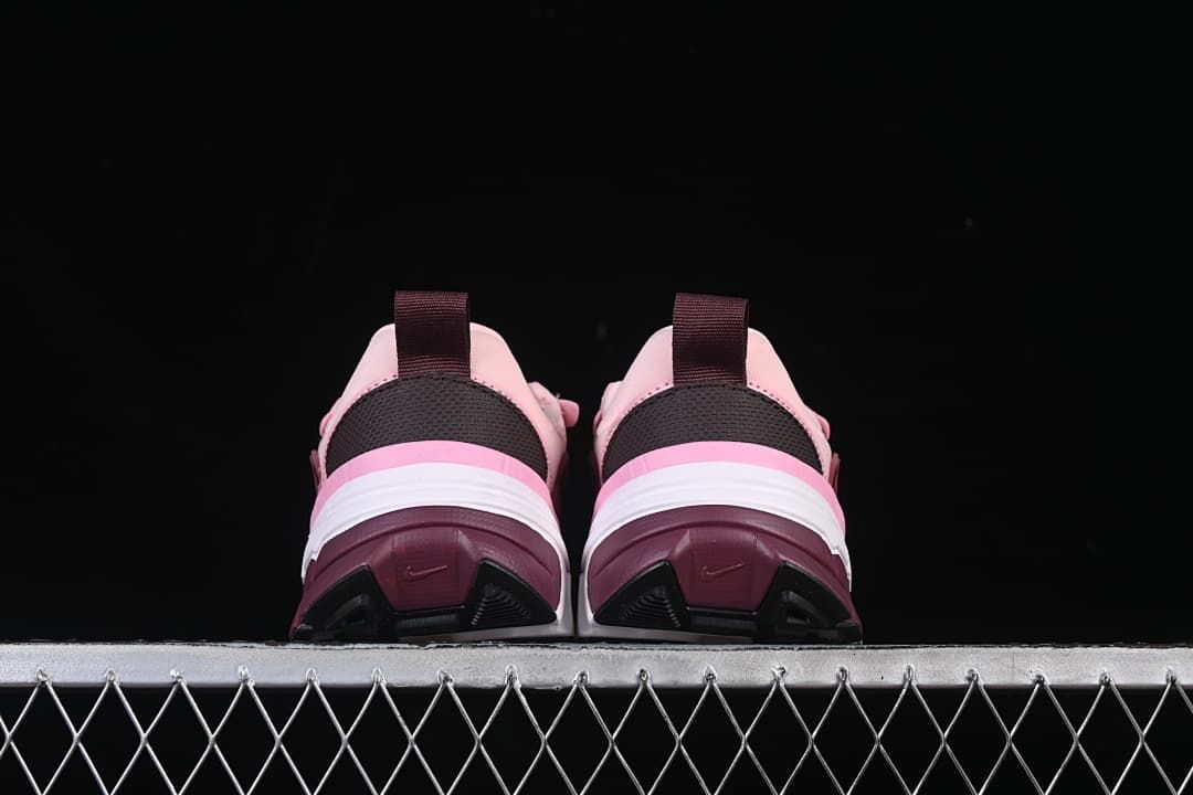 Rear view of both sneakers showing heel panels and outsole details