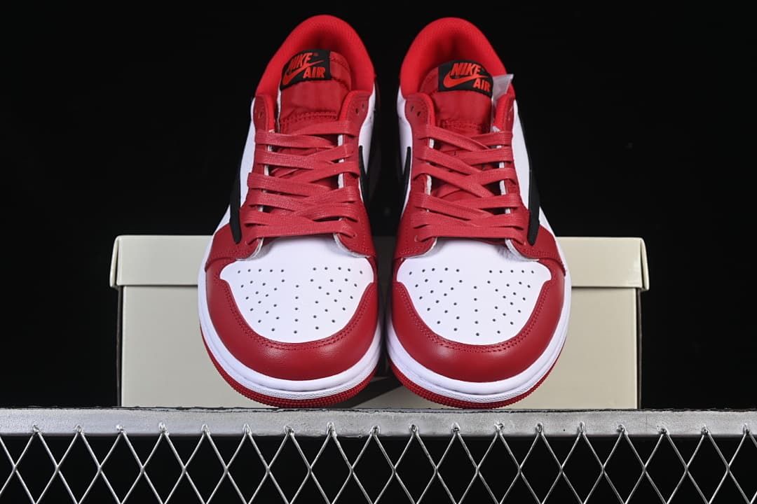 Front view of the pair showing white perforated toe panels and red laces