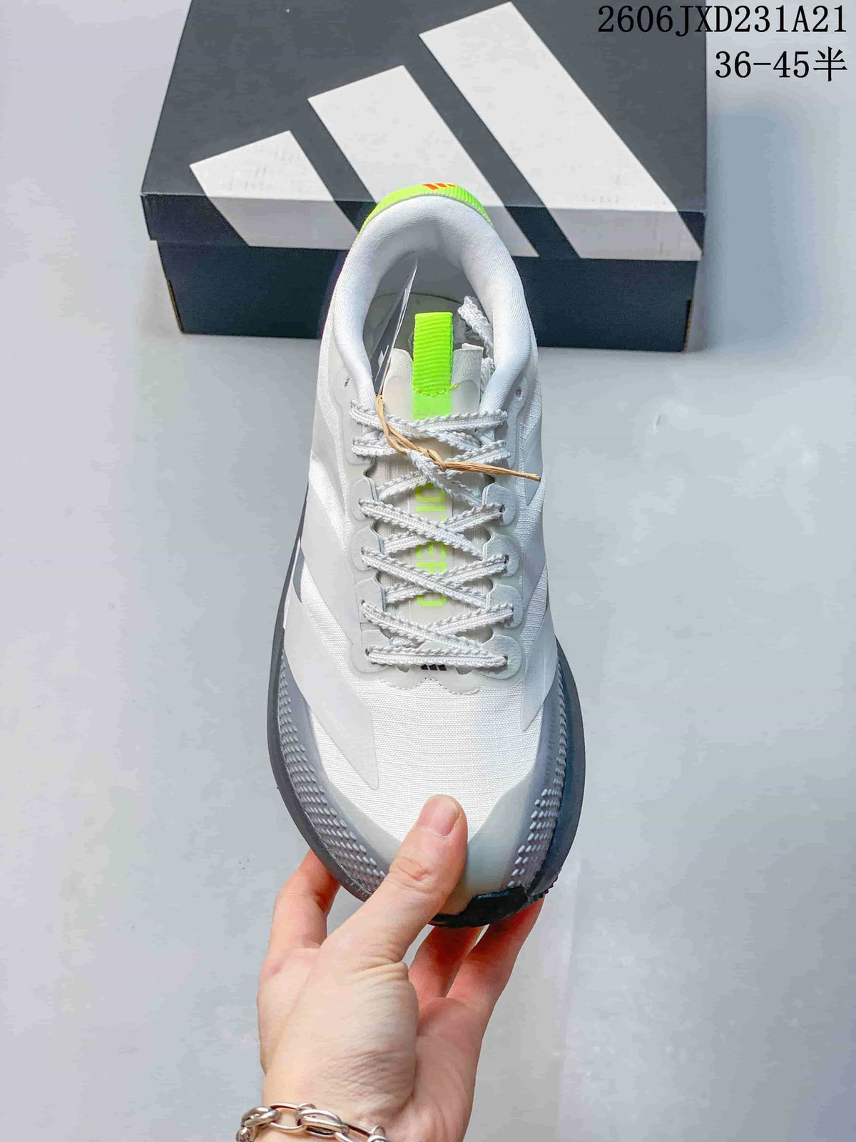 Top view of a white and grey lace-up running shoe with bright lime tongue detail.