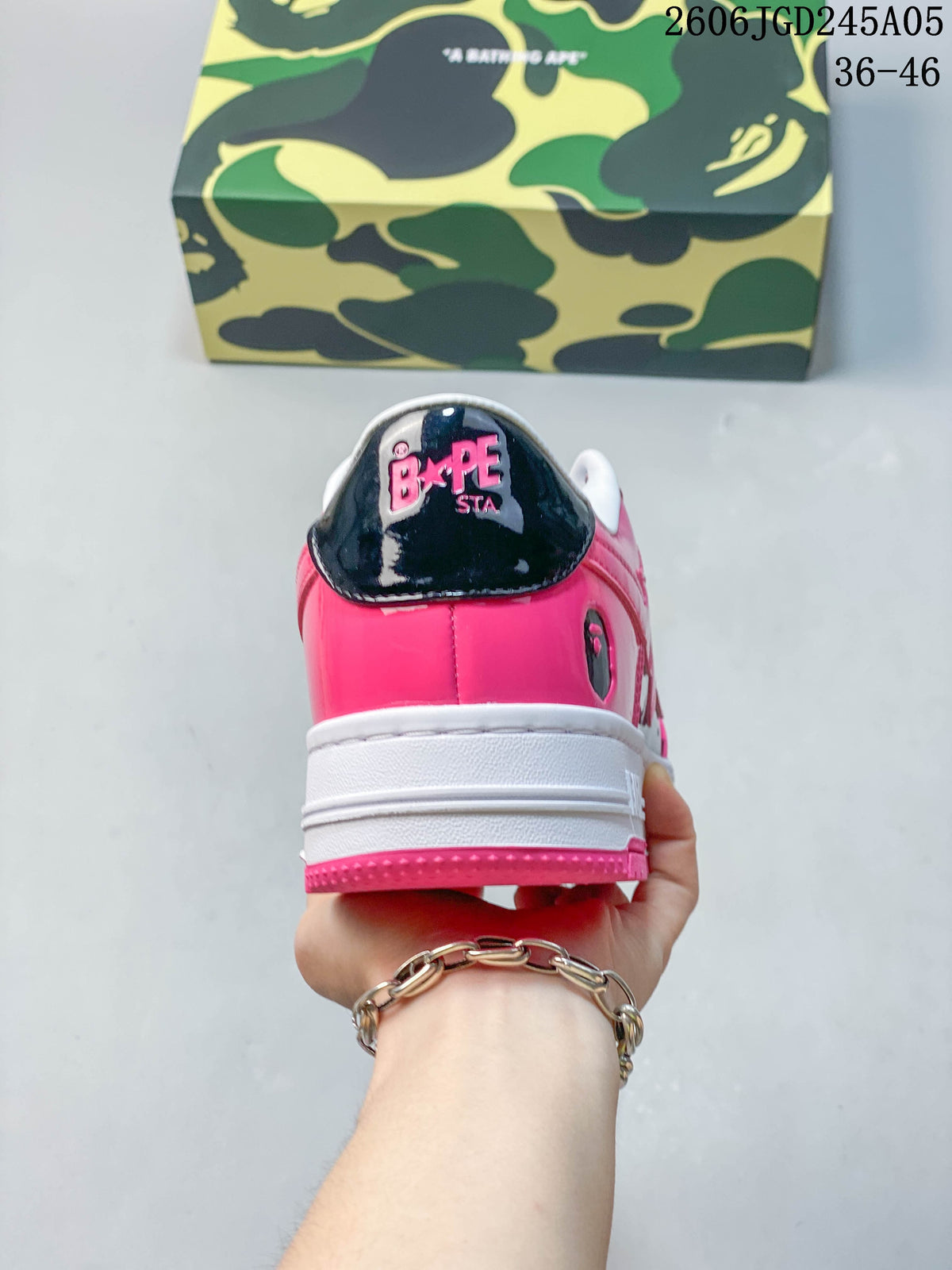 Rear view of pink and black BAPE STA sneakers with branded heel panels