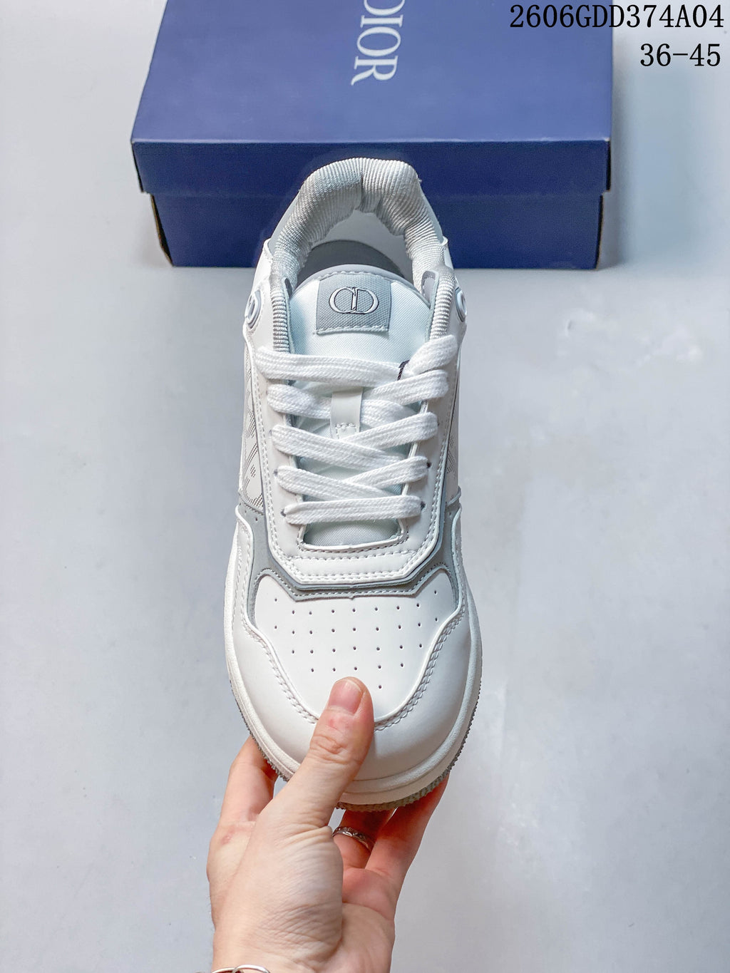 Front view of the sneaker with laces and perforated toe panel