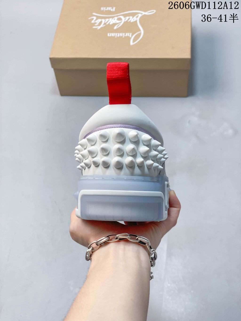 Rear view showing the red heel tab and studded heel panel