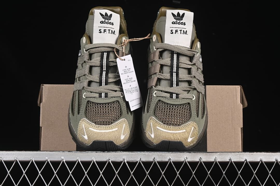 Front view of the pair with mesh toe panels and S.F.T.M. tongue labels.