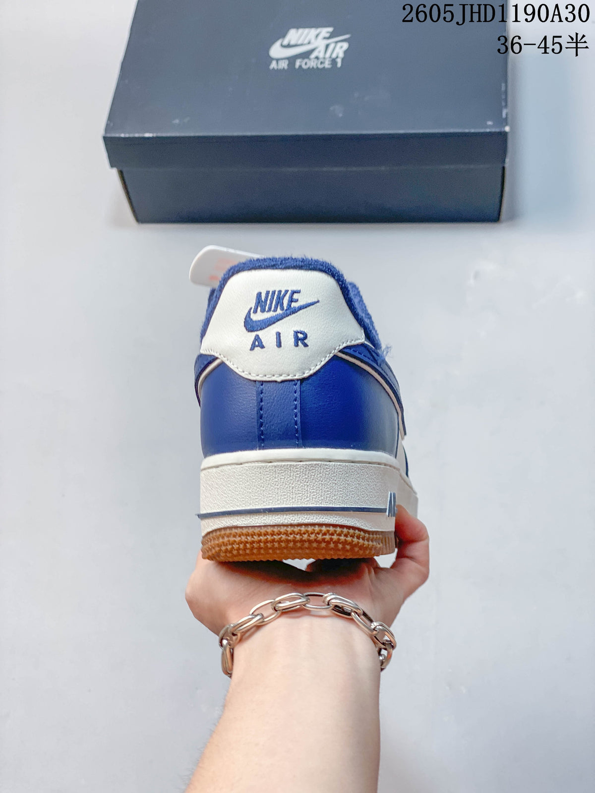 Rear view showing the blue heel and white Nike Air branding.