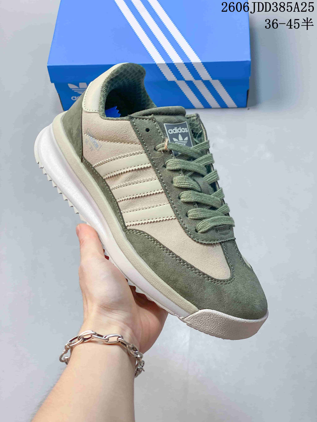 Angled side view of the sage green and cream adidas SL 72 sneaker