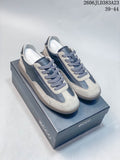 Pair of gray and navy ECCO low-top lace-up sneakers with contrasting panels