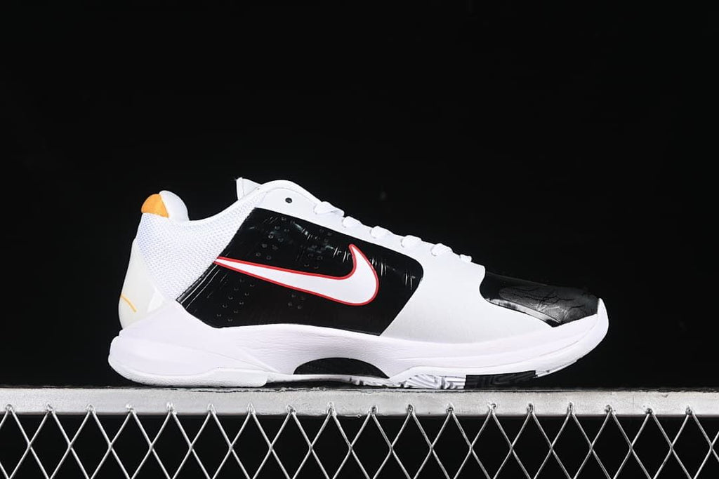 Side profile of a white and black Kobe 5 Protro shoe with red and yellow accents