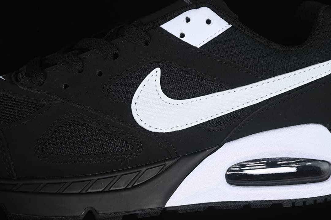 Close-up of the white side Swoosh, mesh panels and heel Air unit
