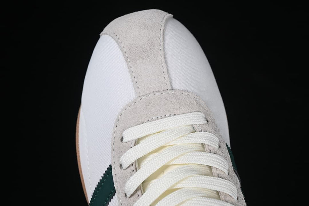 Top view of the gray eyelet overlay and white lace-up front
