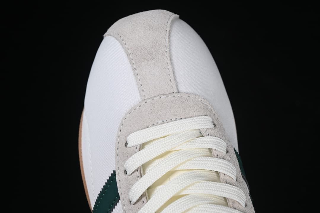 Top view of the gray eyelet overlay and white lace-up front