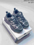 Pair of gray FILA Fusion Arceus sneakers on a shoebox