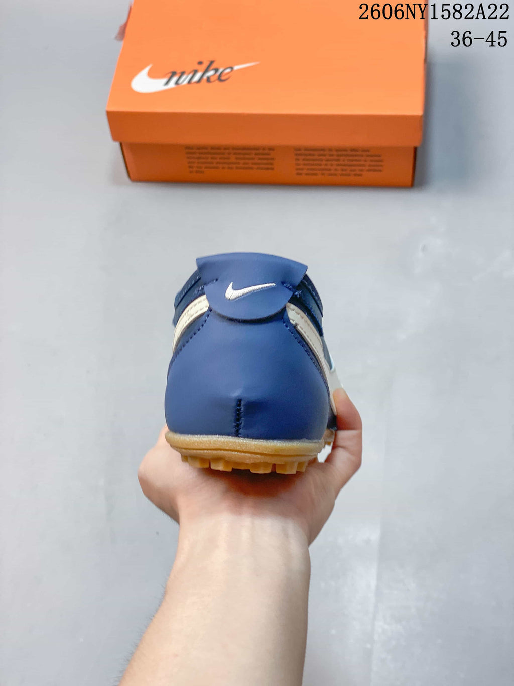 Rear view of the blue sneaker with gum-colored outsole