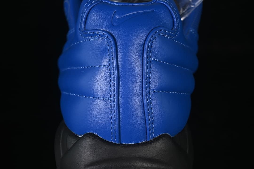 Close-up of the blue sneaker heel and embossed Nike logo.