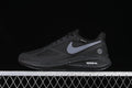 Side view of black Nike Zoom Winflo 7 shoes with a light gray Swoosh and speckled midsole.