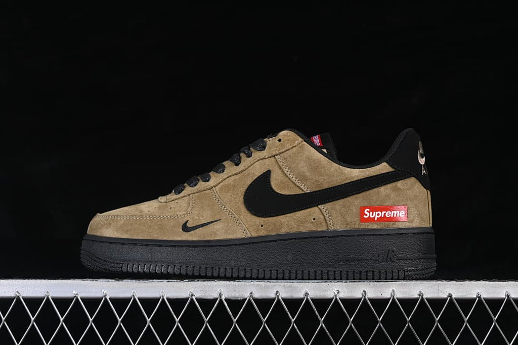 Side view showing khaki and black panels with Supreme branding