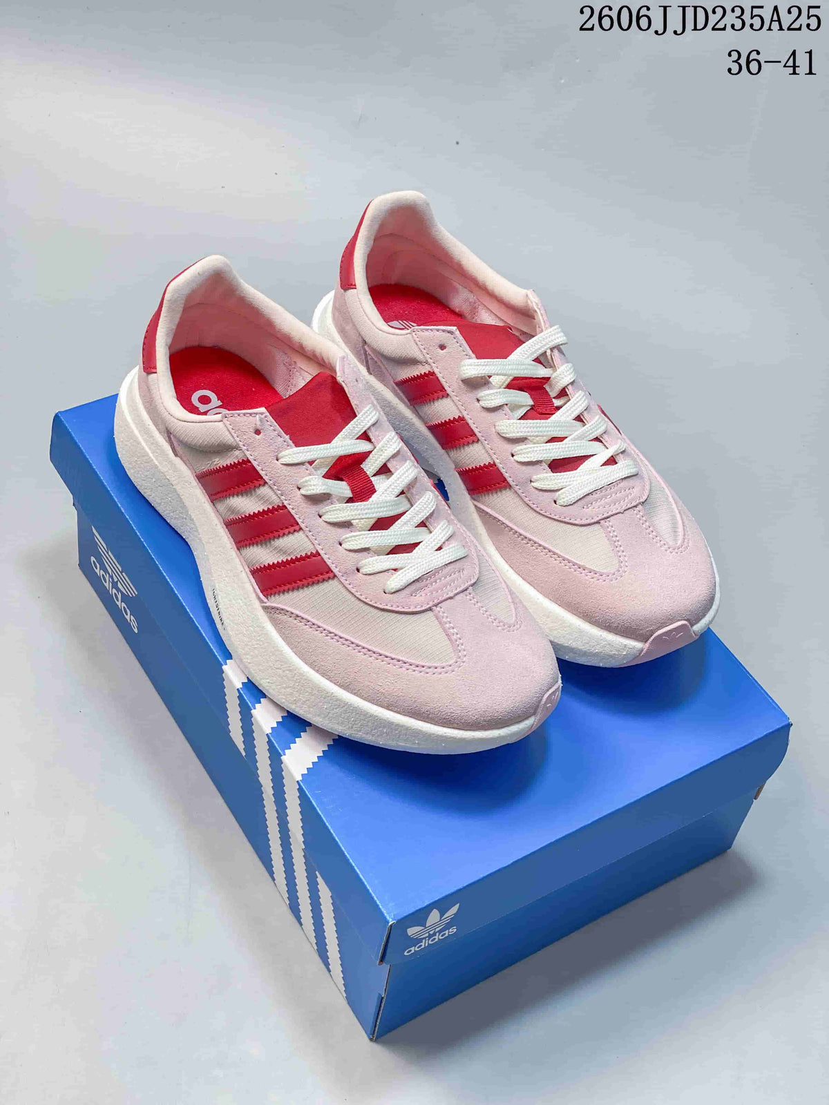 Pair of pink Adidas Adizero SL 72 Pro sneakers with red stripes