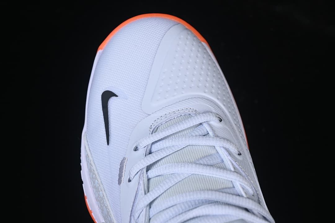 Top view of the shoe toe, laces, and black logo
