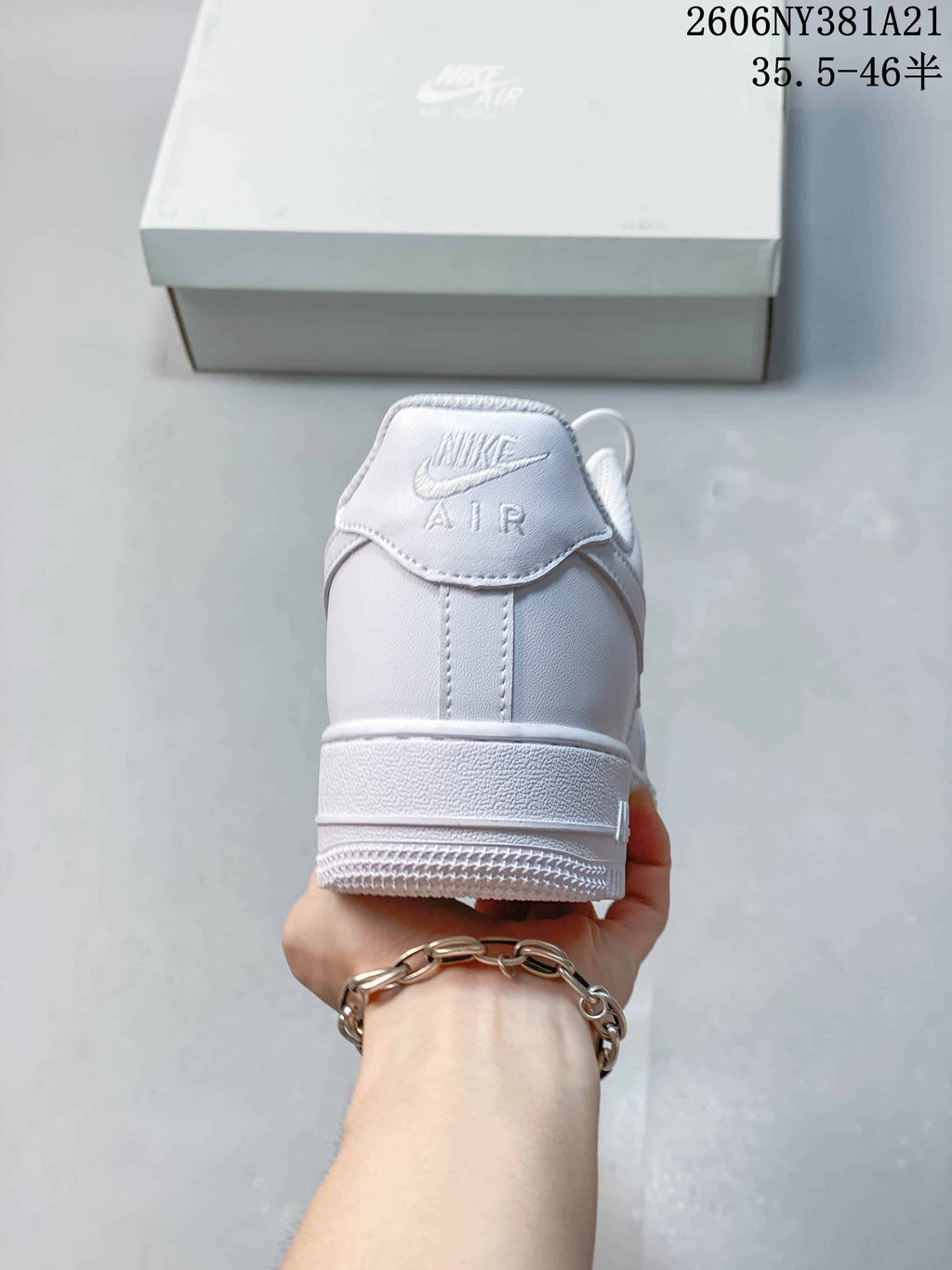 Rear view of a white low-top sneaker with Nike Air branding