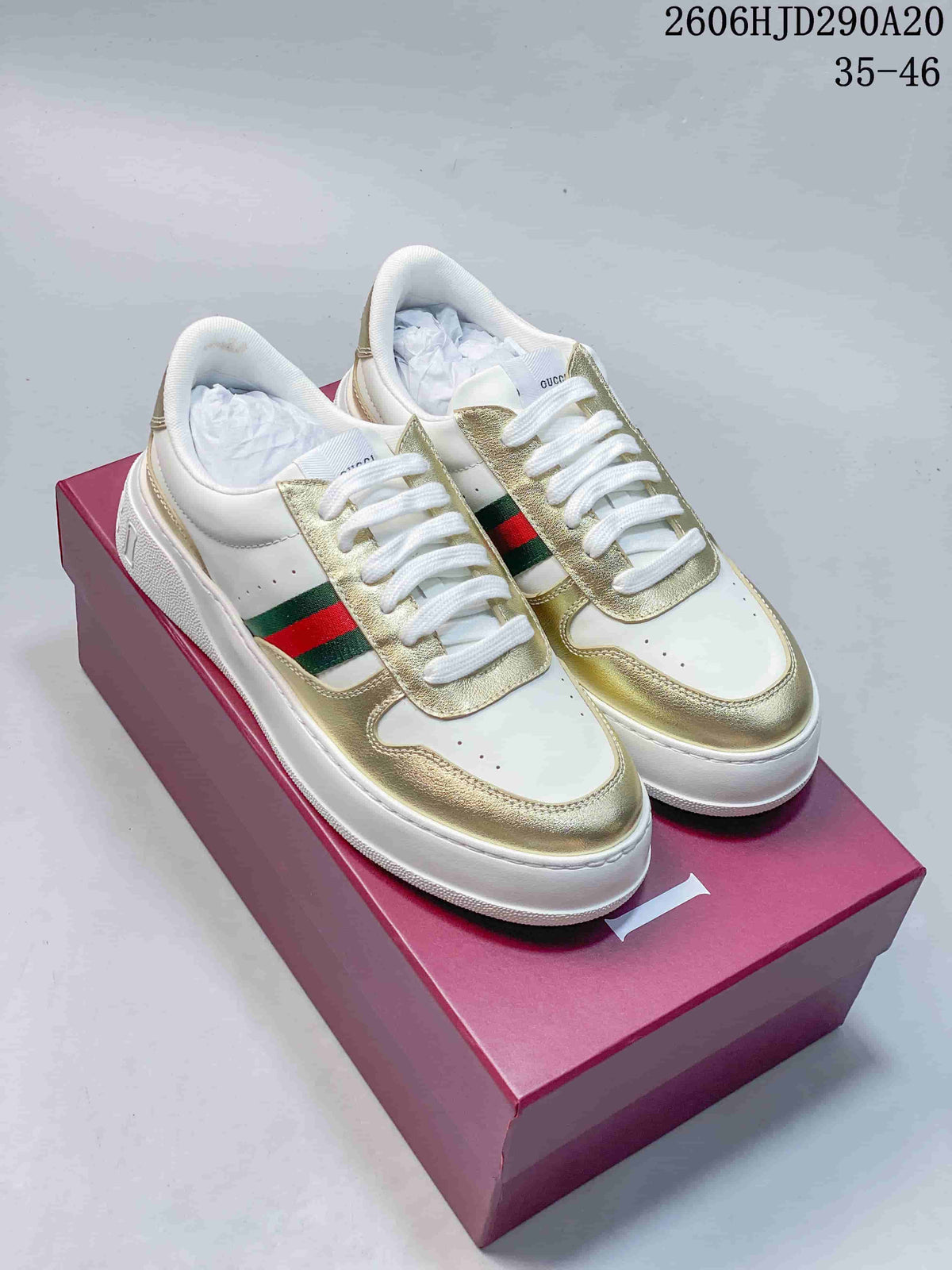 Pair of white and gold-tone Gucci Chunky low-top sneakers with green-and-red side stripes