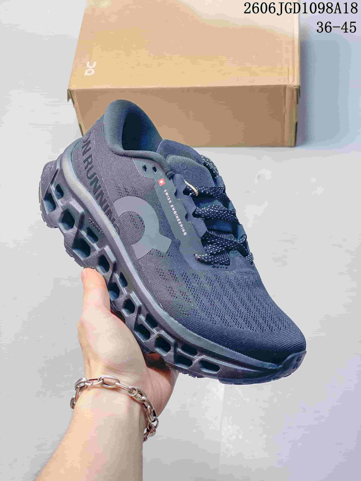 Angled side view showing On branding, laces and sculpted outsole.