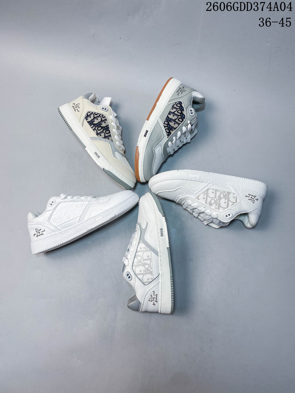 Several white low-top sneakers arranged to show different patterned side panels and accent details.