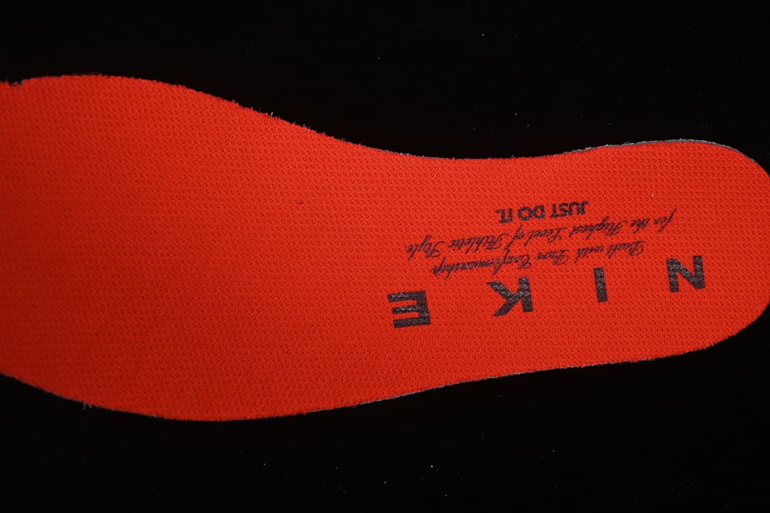 Close-up of the orange-red insole with Nike lettering