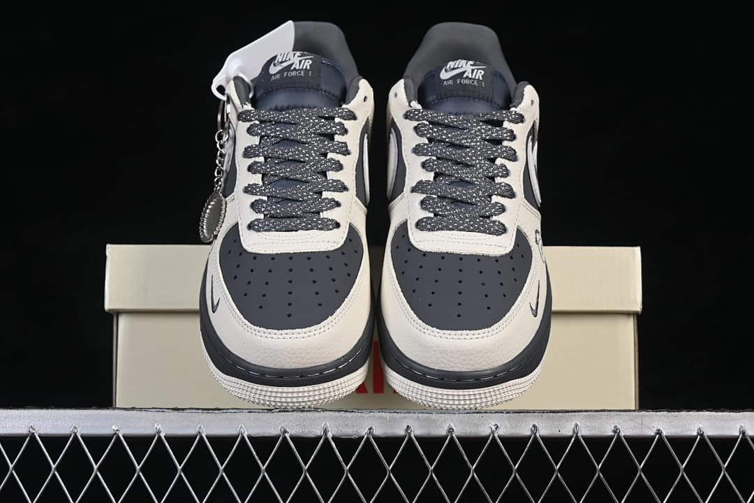 Front view of both sneakers displayed on a shoebox