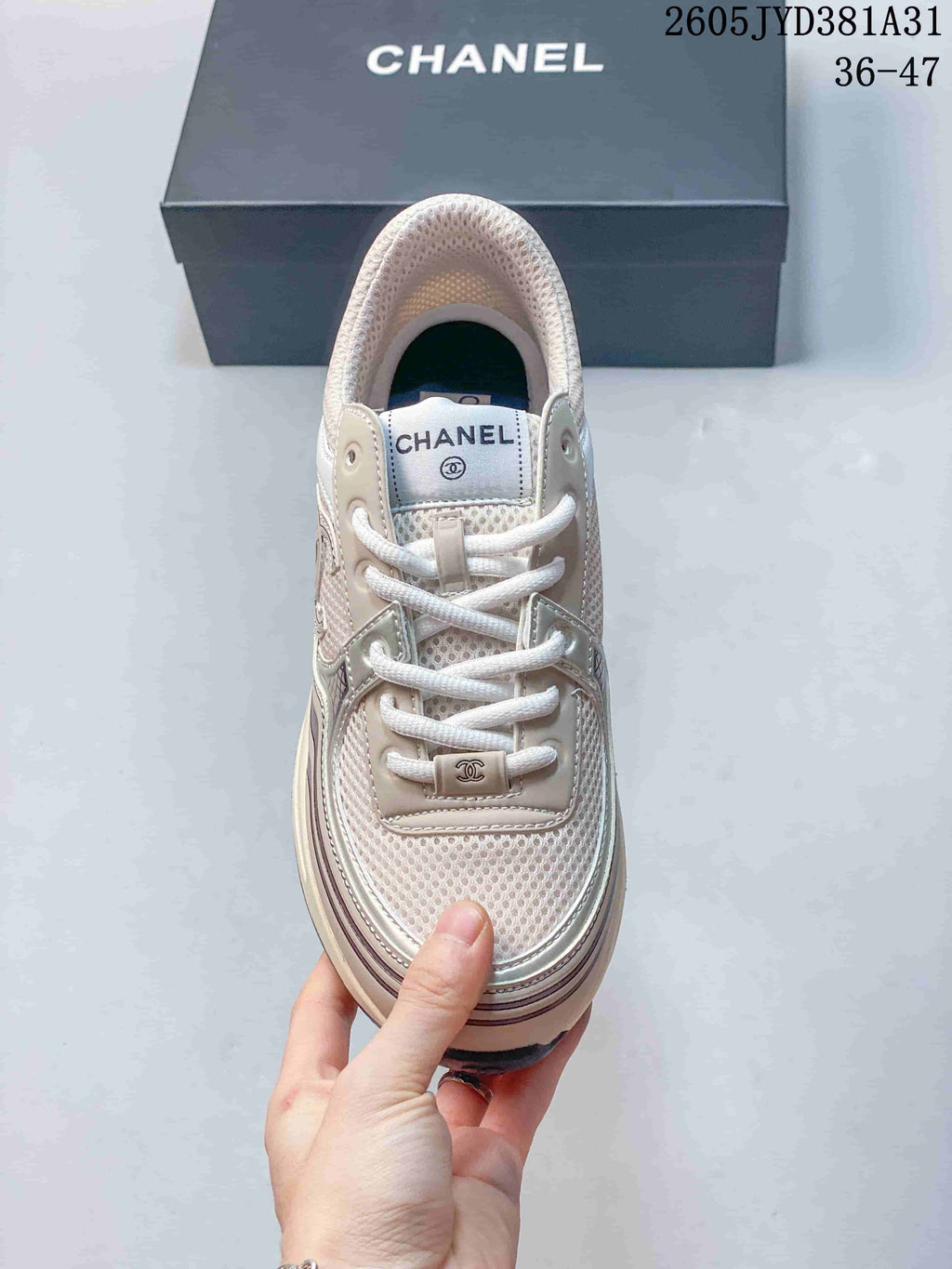 Top view of the lace-up sneaker with mesh tongue and layered trim