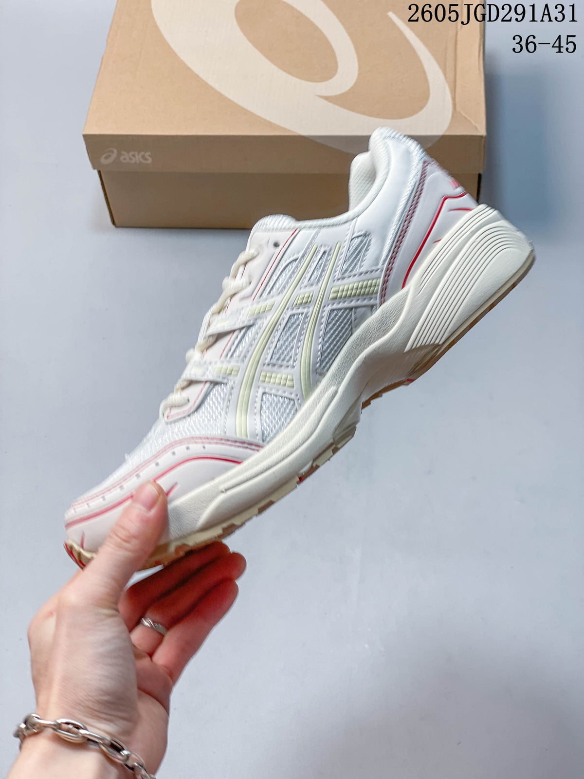 Side view of the white mesh sneaker with red detailing