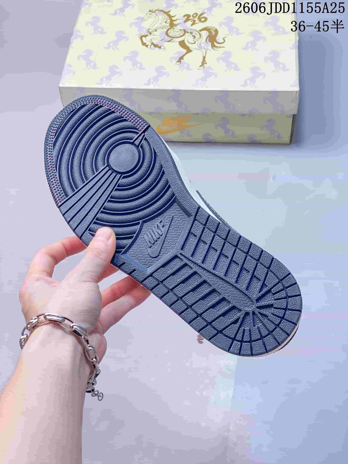 Close-up of the dark blue-gray outsole and circular tread