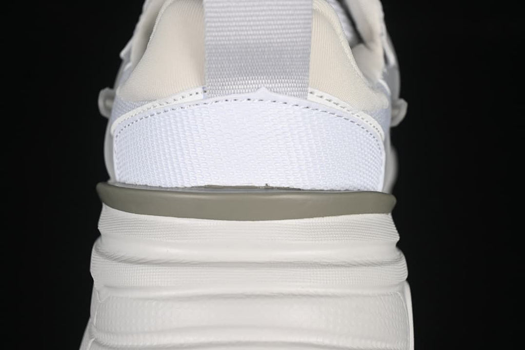 Rear close-up of the sneaker's heel counter, pull tab and midsole