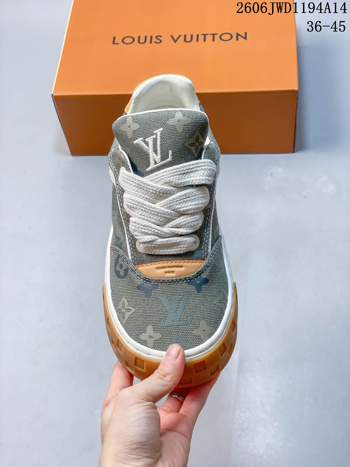 Front view showing the patterned toe, white laces, and tan tongue accent.