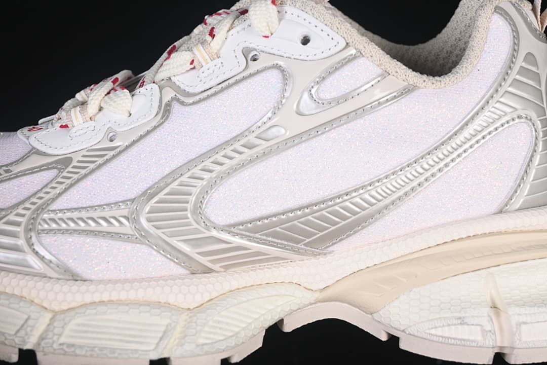Close-up of the layered silver and light-colored side panels