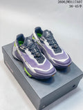 Pair of purple Kailas Fuga trail shoes shown from above on a shoe box.