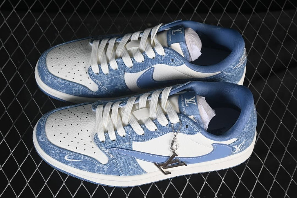 Top view of a pair of blue and white low-top sneakers with denim-patterned panels and white laces.