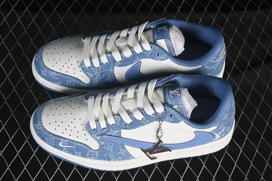 Top view of a pair of blue and white low-top sneakers with denim-patterned panels and white laces.