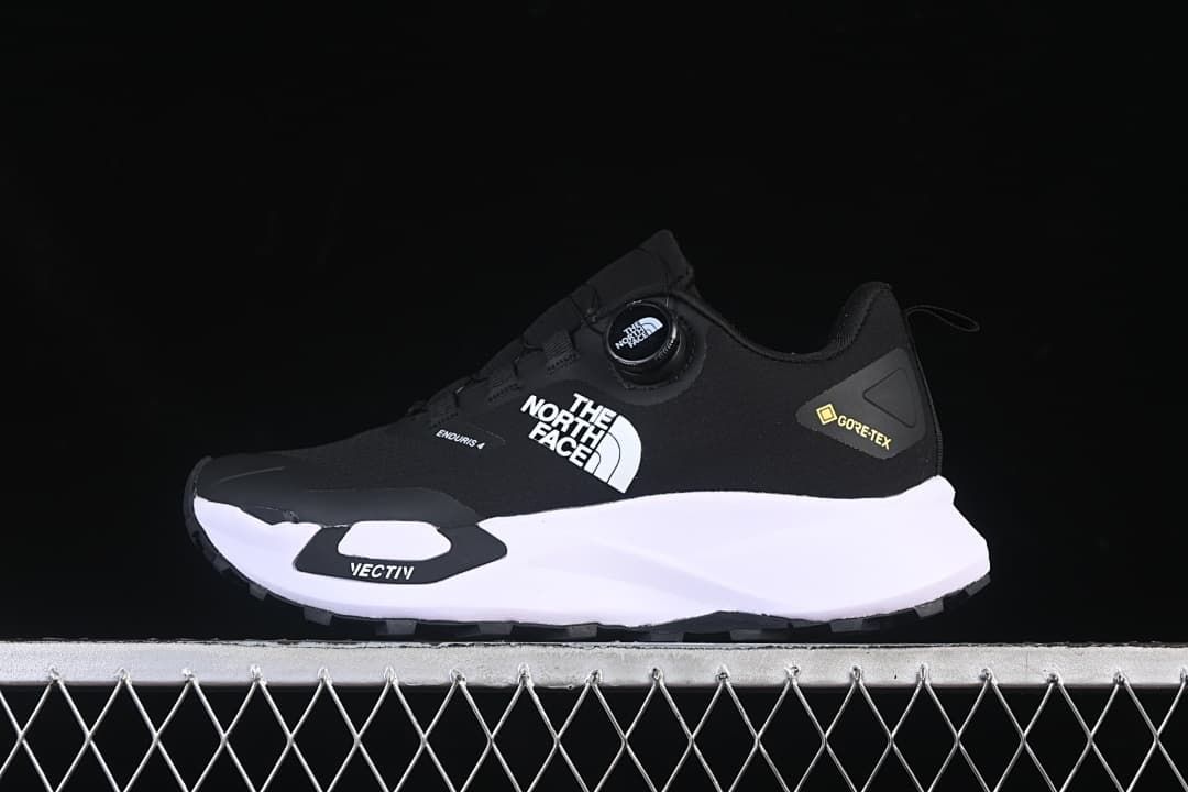 Side view of the shoe with dial lacing, Vectiv marking, and white midsole.