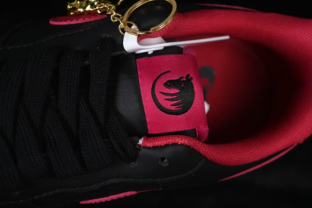 Close-up of the tongue label and a gold-tone lace charm