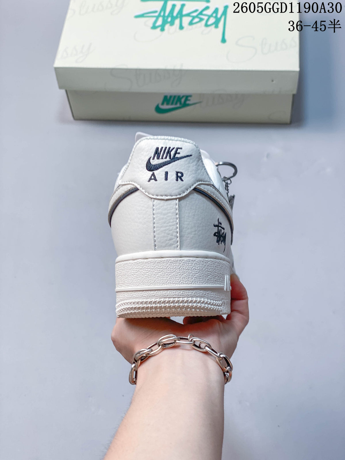 Rear view of a white low-top sneaker with Nike Air branding