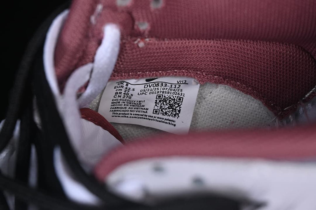 Close-up of shoe label showing style code DV0833-112 and EU size 42.5