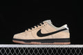 Side view of a beige and black Nike SB Dunk Low with a gum-colored outsole