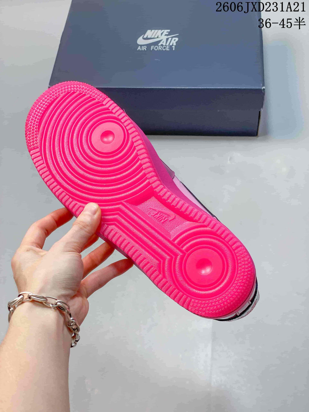Bright pink outsole of a Nike Air Force 1 sneaker