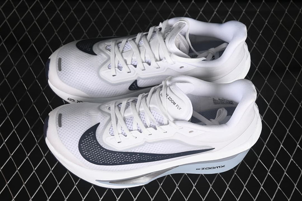 Pair of white Nike Zoom Fly 6 shoes shown from above at an angle.