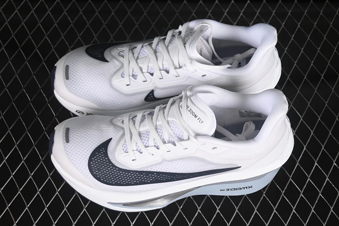 Pair of white Nike Zoom Fly 6 shoes shown from above at an angle.